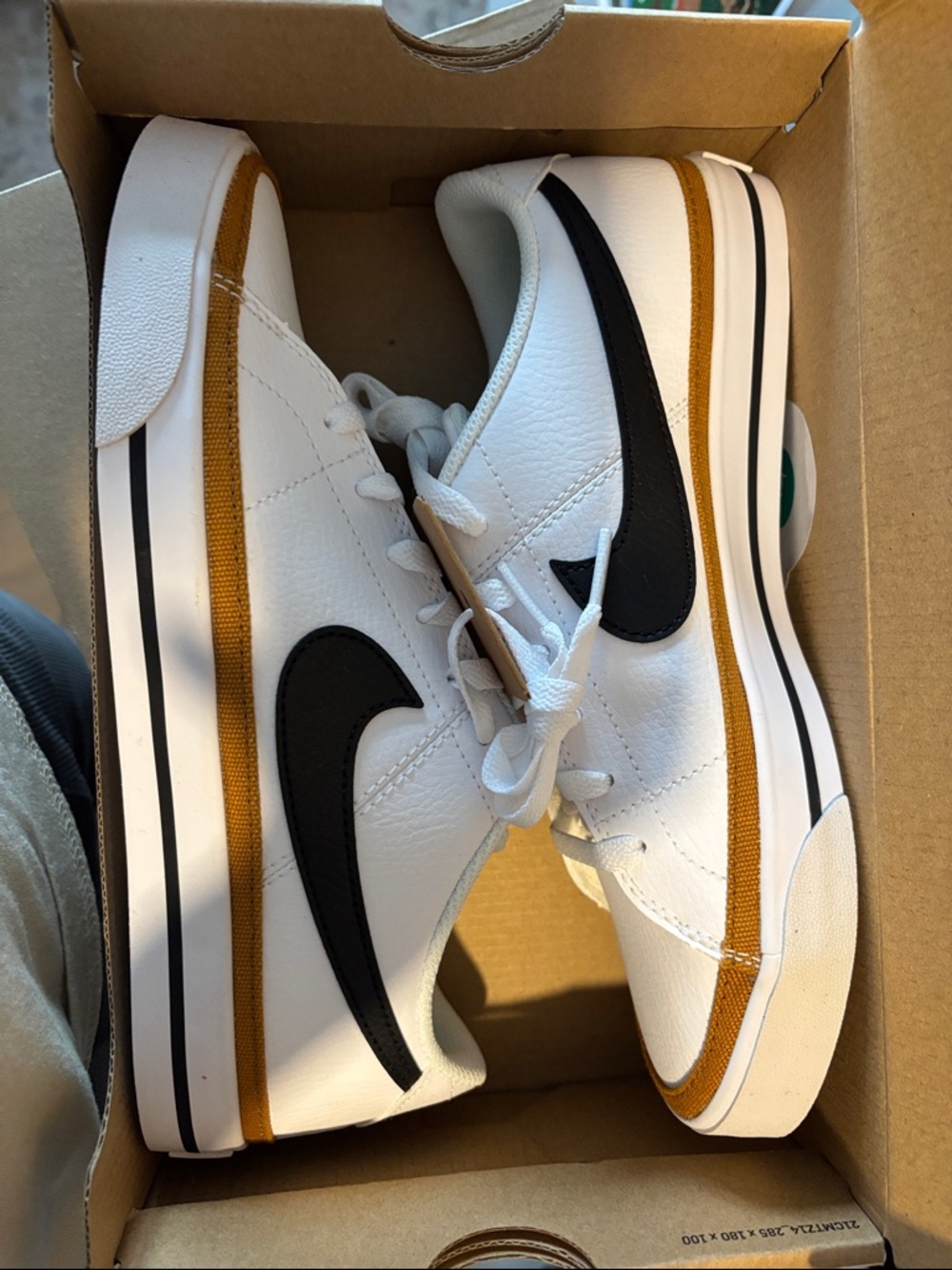 Nike Men’s White Sneakers with Black Swoosh and Tan Accents